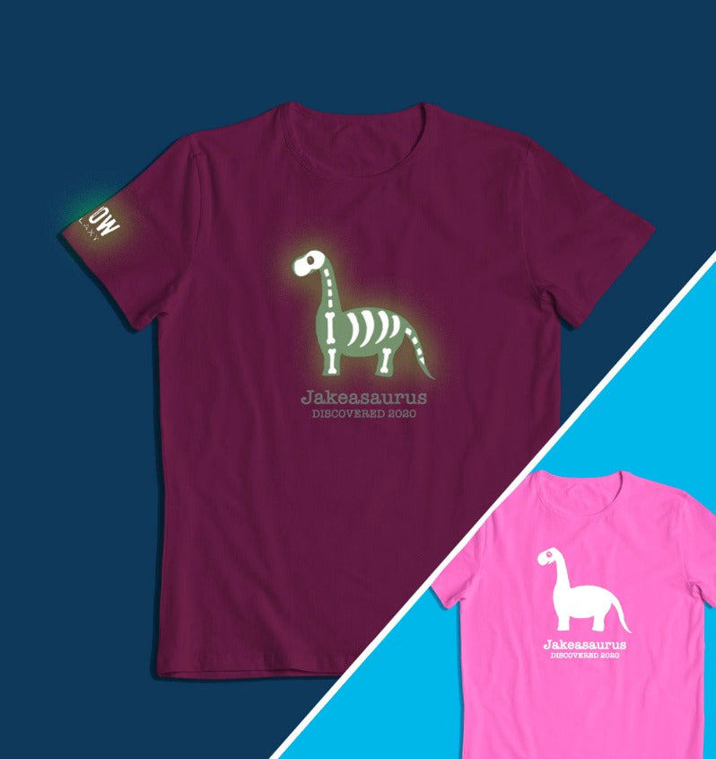 a personalised dinosaur t-shirt that glows in the dark in pink