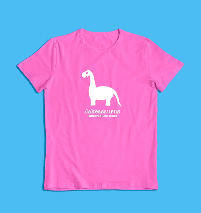 a personalised dinosaur t-shirt that glows in the dark in pink