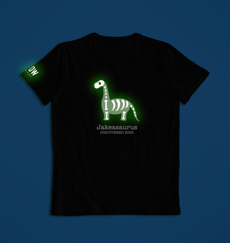 a personalised dinosaur t-shirt that glows in the dark in black