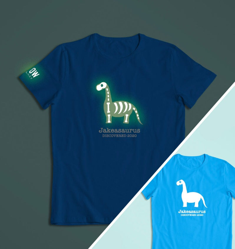 a personalised dinosaur t-shirt that glows in the dark in blue