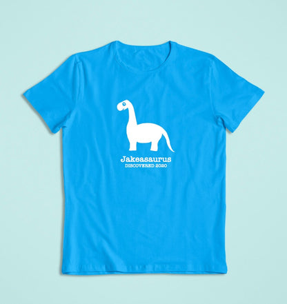 a personalised dinosaur t-shirt that glows in the dark in blue