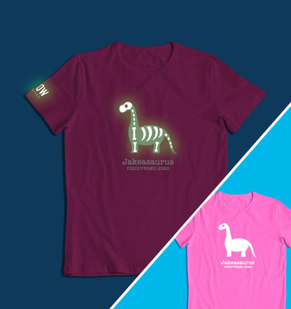 a personalised dinosaur t-shirt that glows in the dark in pink