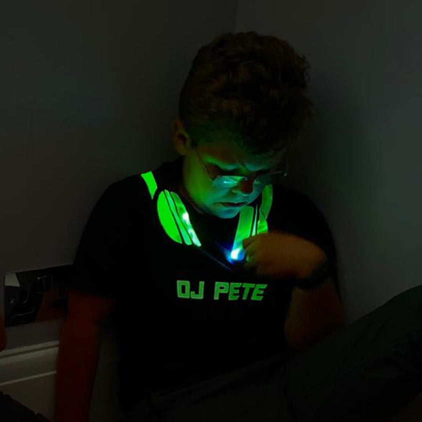 boy playing with DJ T-shirt